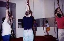 a team (band) of bellringers standing in a circle